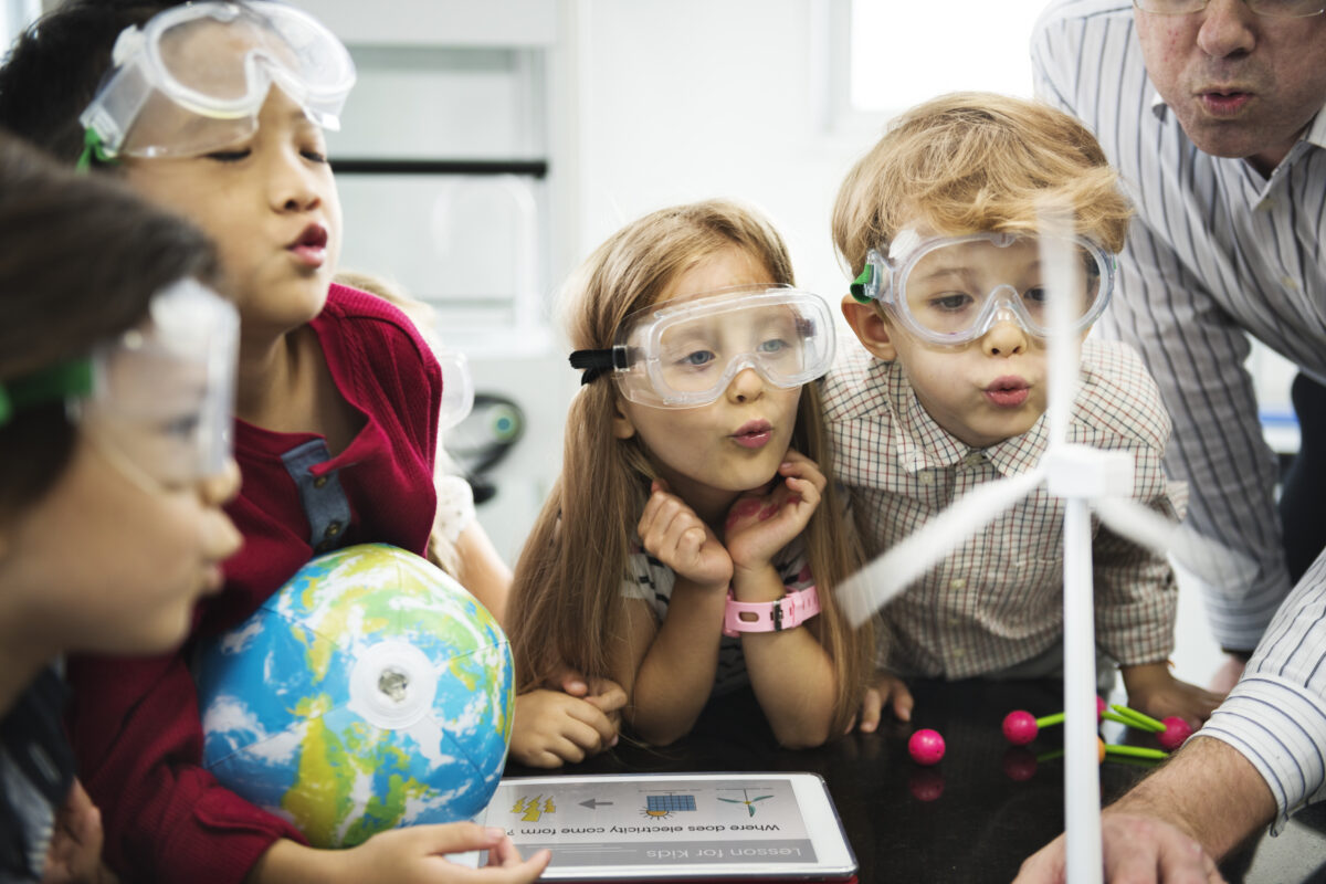 young children blowing